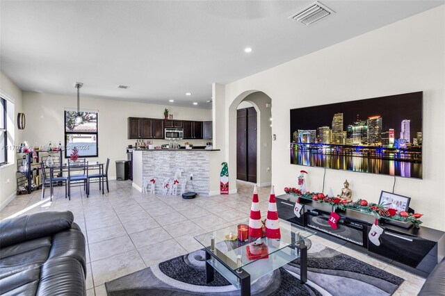 living room with light tile patterned floors