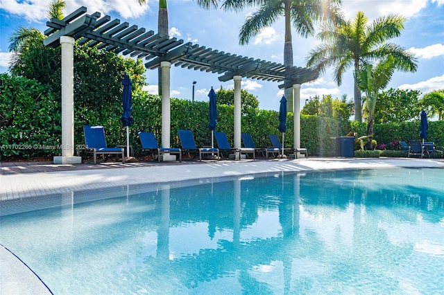 view of swimming pool with a pergola and a patio area