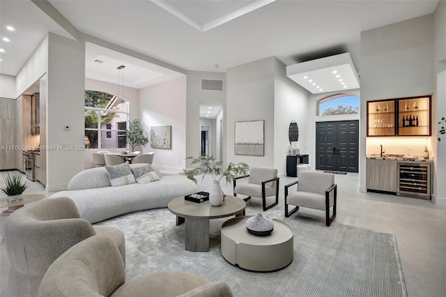 living room with wet bar and beverage cooler