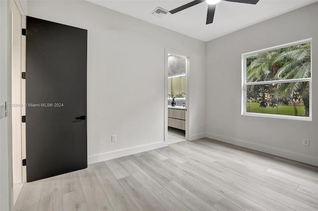 spare room with ceiling fan and light hardwood / wood-style floors