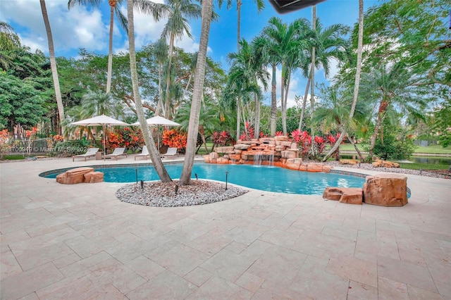 view of swimming pool with a patio area