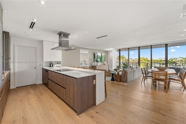 dining area featuring light wood-type flooring