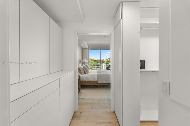 hallway featuring light wood-style flooring