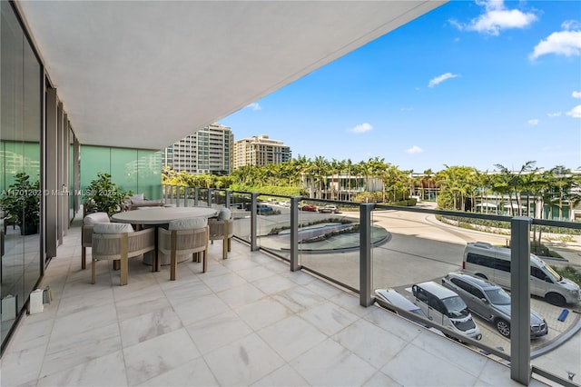 balcony featuring outdoor dining space