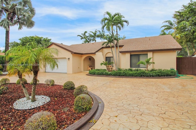 ranch-style home featuring a garage