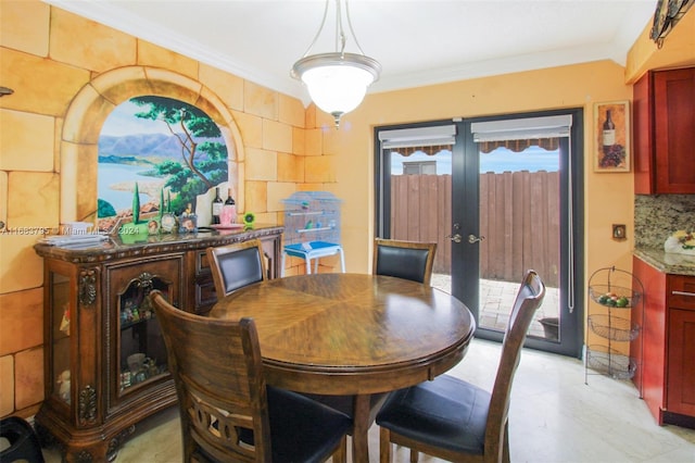 dining area featuring crown molding