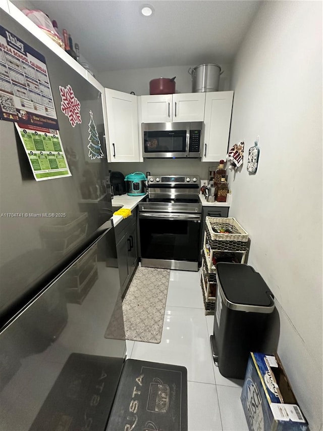 kitchen featuring appliances with stainless steel finishes and white cabinets