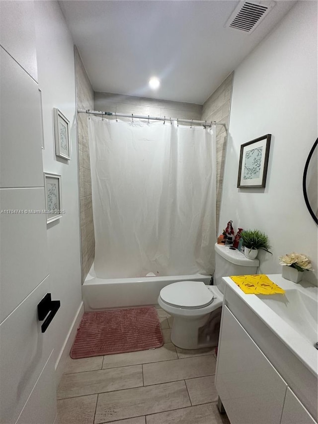 full bathroom featuring vanity, shower / bath combination with curtain, and toilet