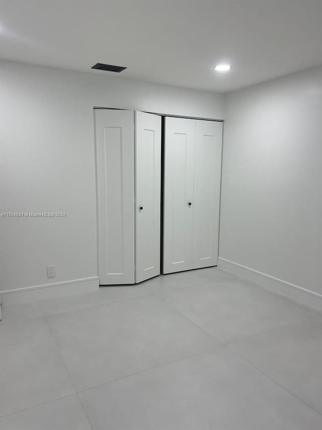 unfurnished bedroom with a closet