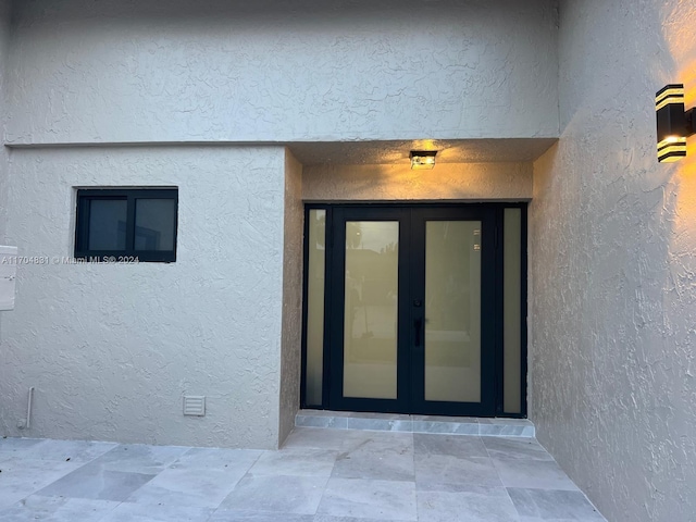 doorway to property featuring french doors