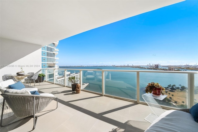 balcony featuring a water view