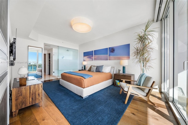 bedroom with wood-type flooring