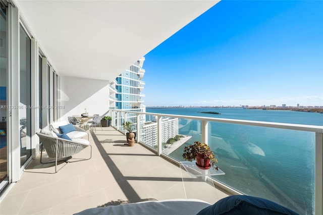 balcony featuring a water view