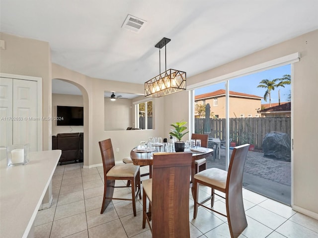 dining area with ceiling fan and light tile patterned flooring