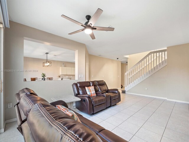 tiled living room featuring ceiling fan