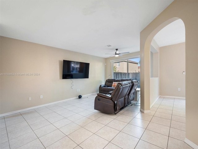 living room with ceiling fan and light tile patterned flooring