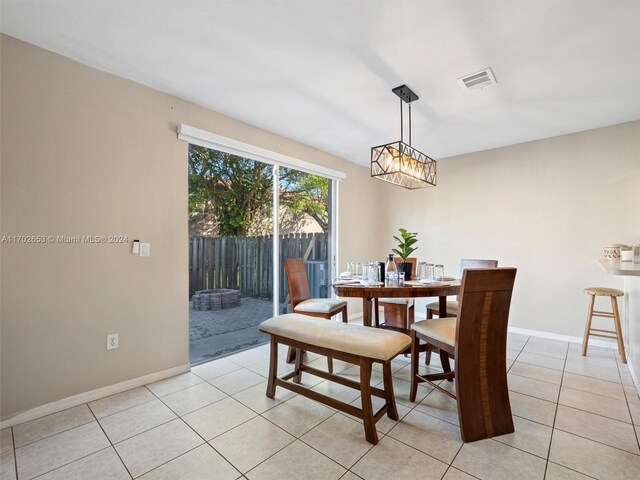 dining space with light tile patterned floors