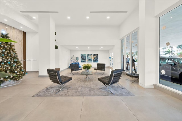 living room with a high ceiling