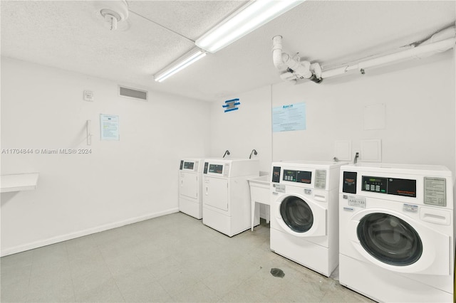 laundry area with separate washer and dryer