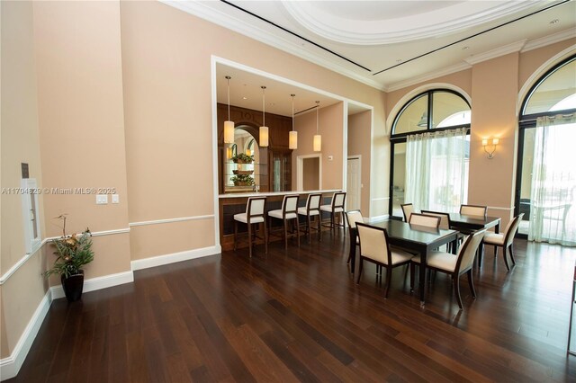 dining room featuring dark hardwood / wood-style floors and ornamental molding