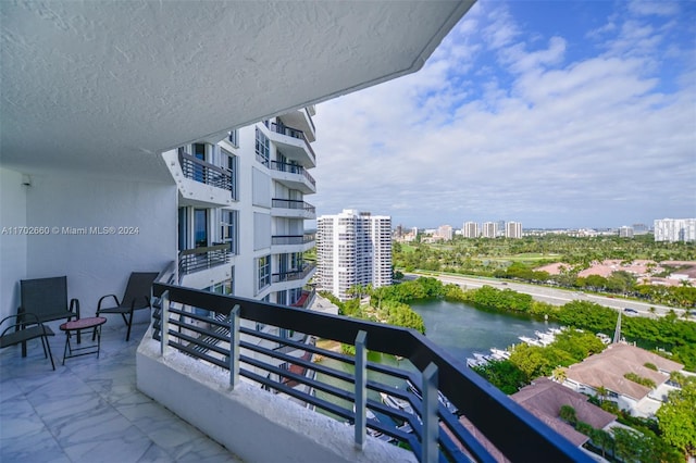 balcony featuring a water view