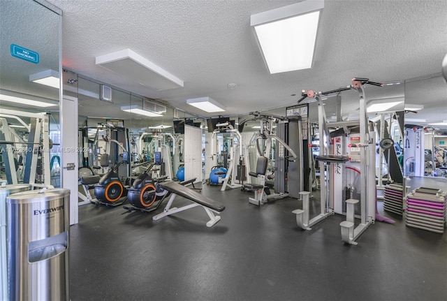 workout area featuring a textured ceiling