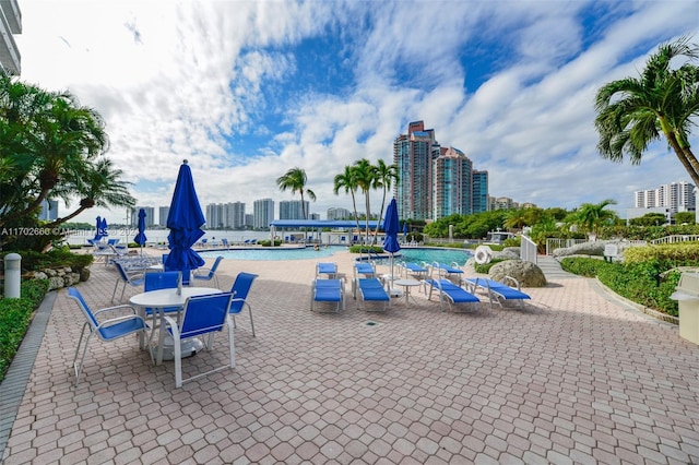 view of patio / terrace featuring a community pool