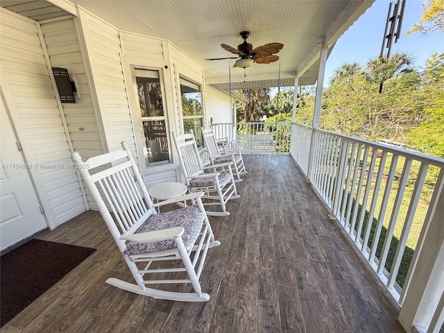 deck with ceiling fan and a porch