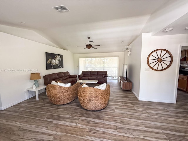 living room with lofted ceiling and ceiling fan