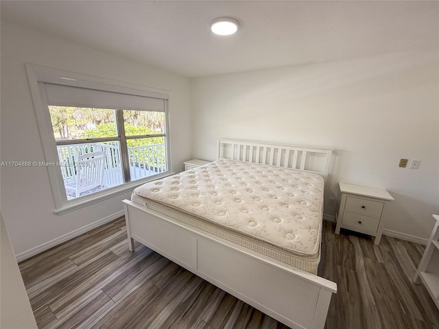 bedroom featuring dark hardwood / wood-style flooring