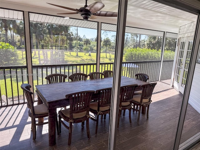 sunroom / solarium featuring ceiling fan