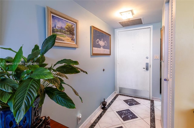 entryway featuring light tile patterned floors