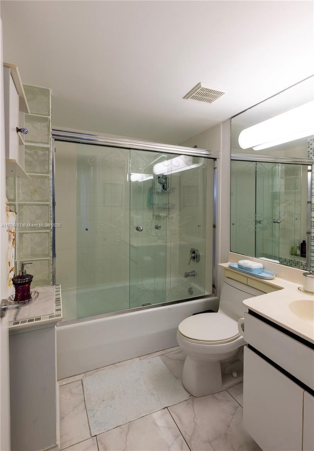 full bathroom with vanity, enclosed tub / shower combo, and toilet