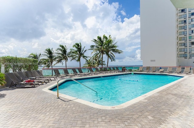 view of swimming pool with a patio