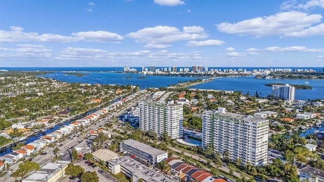 birds eye view of property with a view of city and a water view