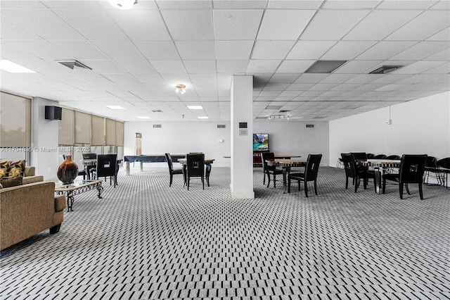 miscellaneous room featuring carpet, a paneled ceiling, and visible vents