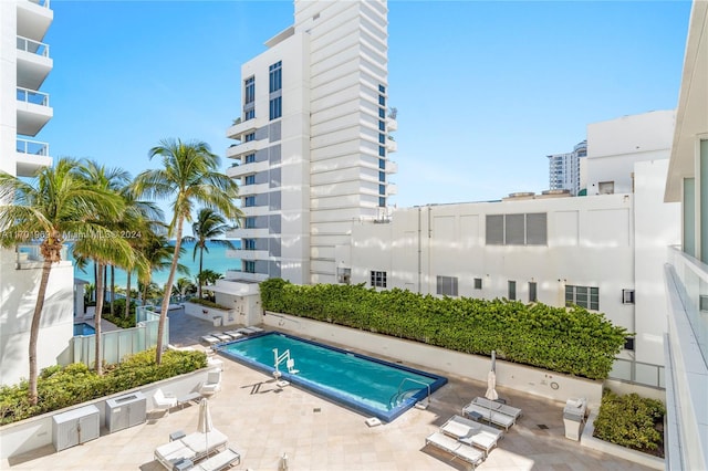 view of swimming pool with a patio area