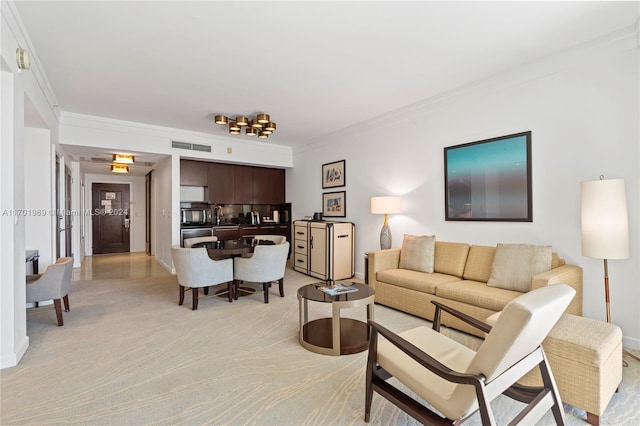 living room featuring crown molding and light carpet