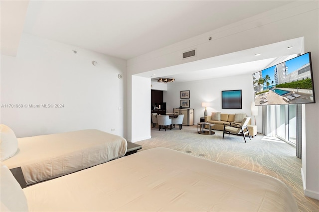 bedroom featuring light colored carpet