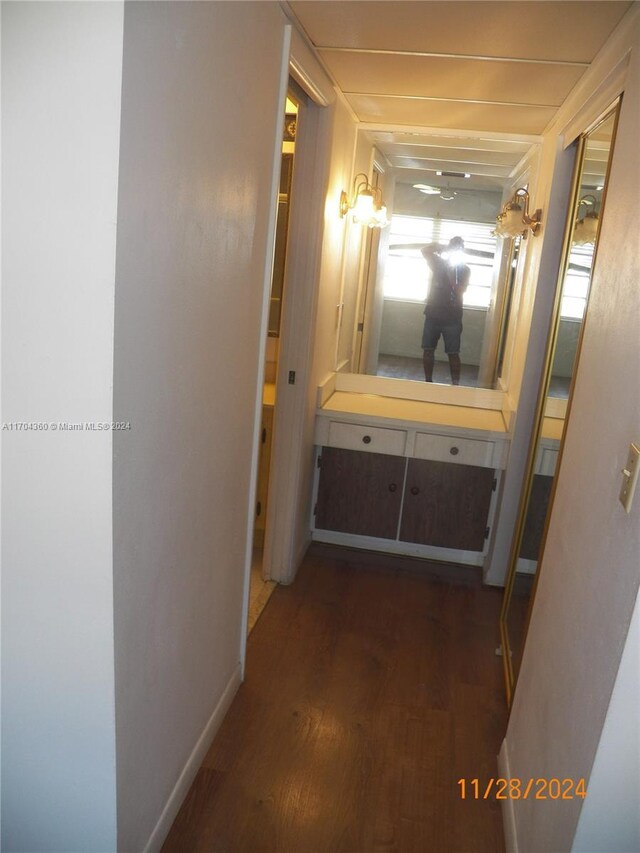 hallway with dark hardwood / wood-style floors