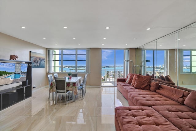 living room with floor to ceiling windows and a wealth of natural light