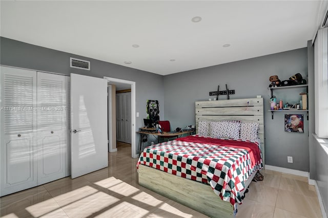 bedroom featuring light tile patterned flooring