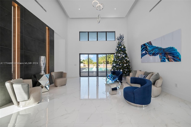 living room featuring french doors and a high ceiling