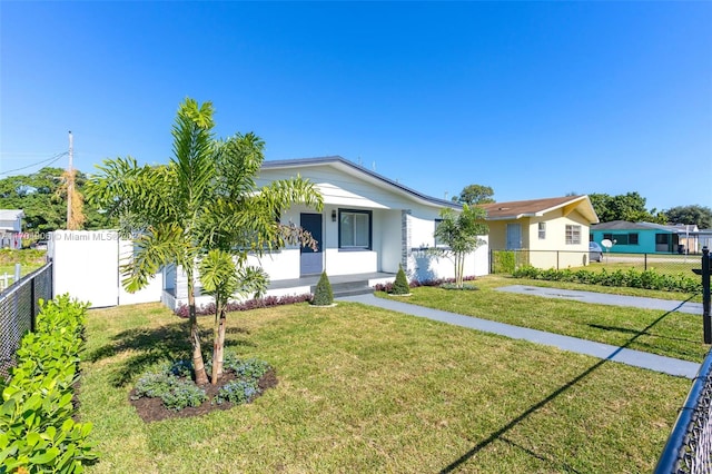 single story home with a front yard