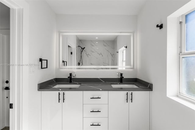 bathroom with vanity and walk in shower