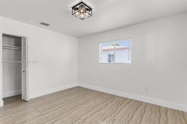 unfurnished bedroom with a closet