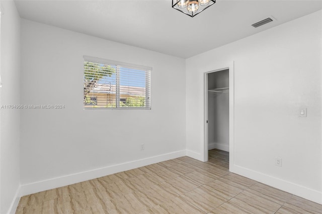 unfurnished bedroom with a closet