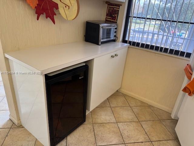1530 Whitehall Dr Unit 204, Davie, FL 33324 - interior space with baseboards, a toaster, and refrigerator