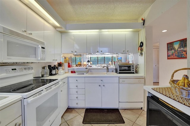 kitchen featuring a textured ceiling, white appliances, white cabinetry, and sink