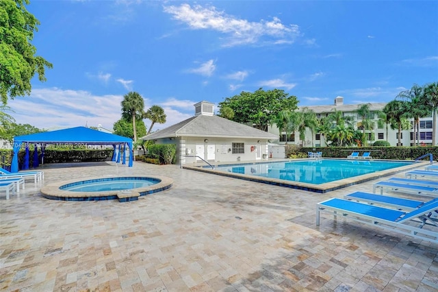 view of pool featuring a gazebo, a hot tub, and a patio area